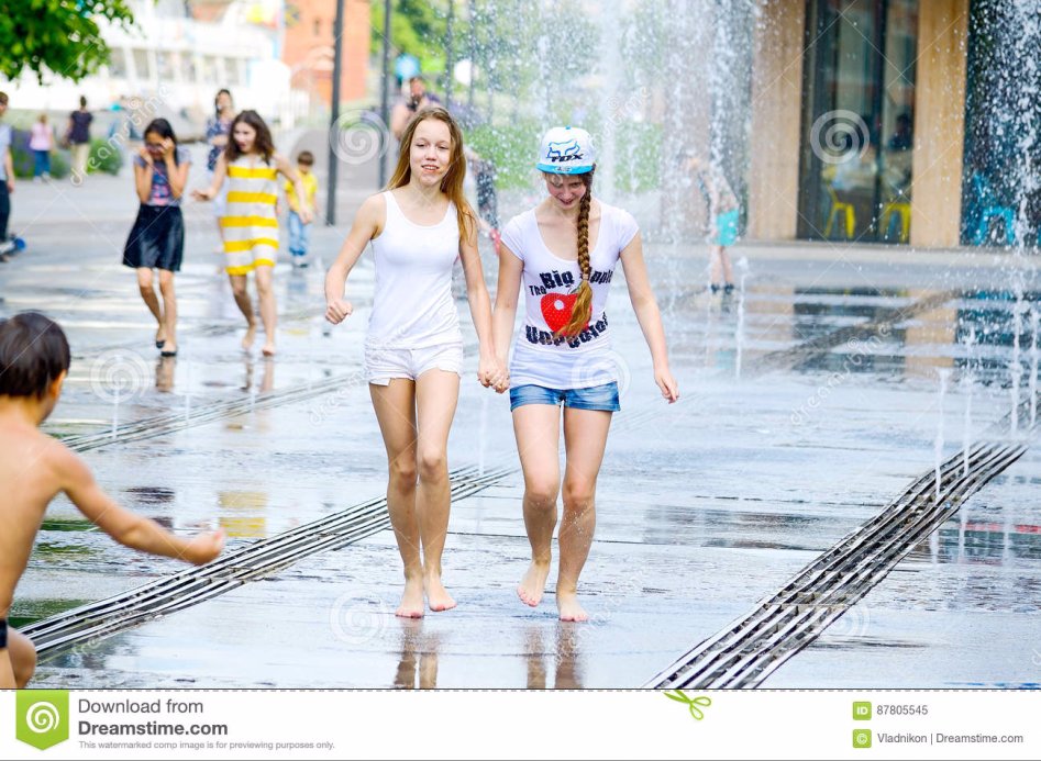 girls-street-fountain-moscow-russia-may-unknown-two-bathing-city-hot-summer-heat-wet-shorts-t-shirts-bright-emotions-face-87805545.jpg